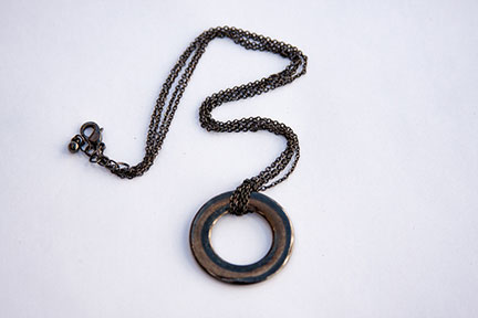 Necklace with black circle charm