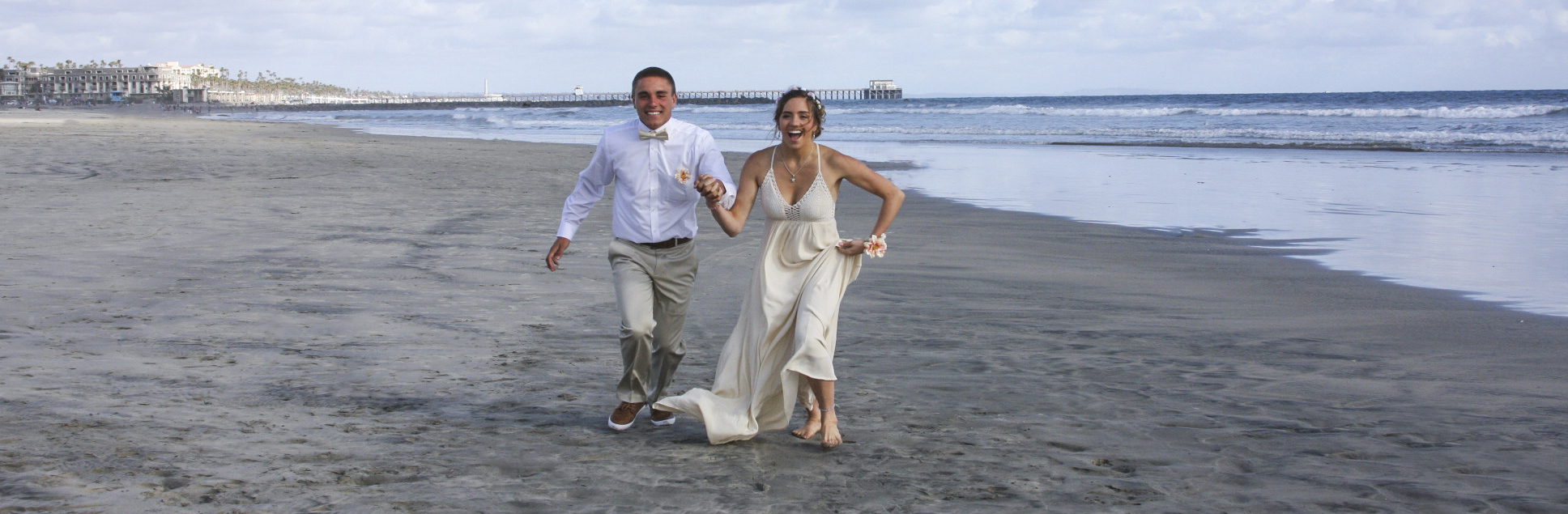 Breana and Dylan running on the beach